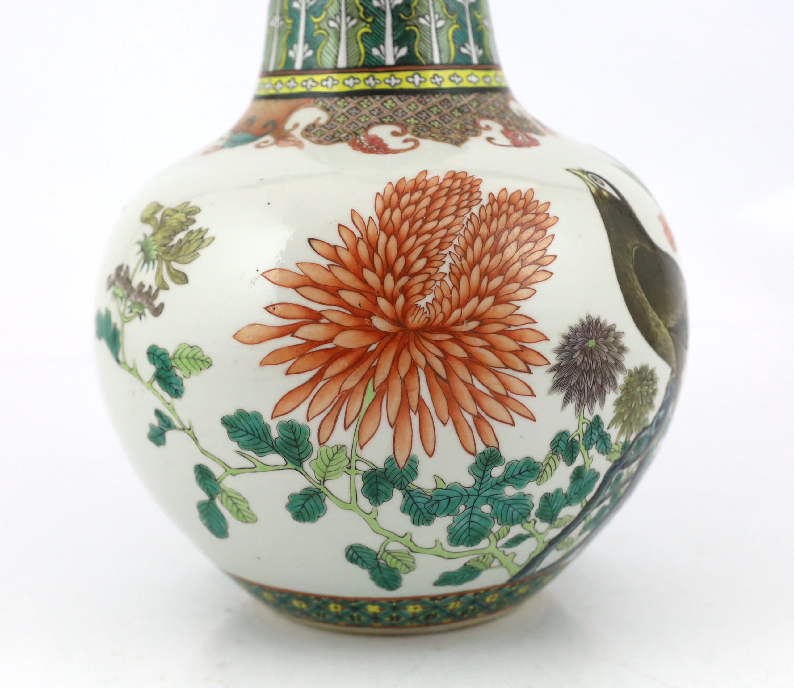 A Chinese famille verte ‘black bird’ bottle vase, Daoguang mark and of the period (1821-50), neck restored